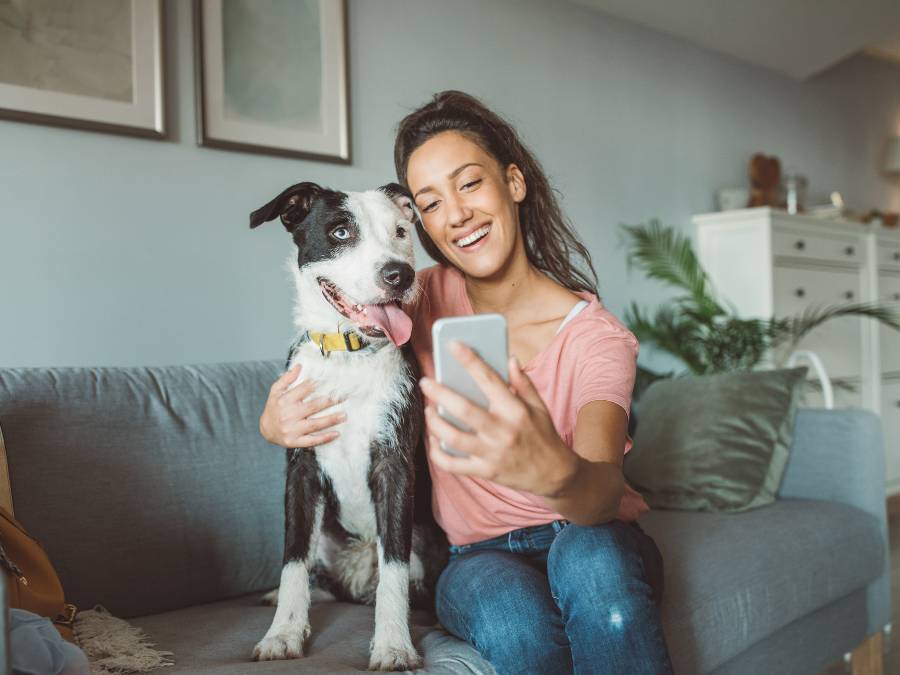 girl taking selfie with pet